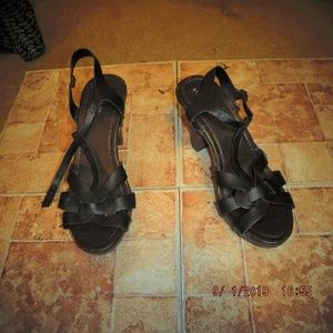 Black strappy sandals with black sole.